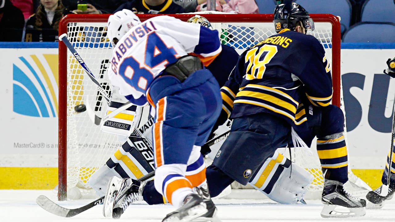 Short-handed Islanders defeat Sabres to take division lead